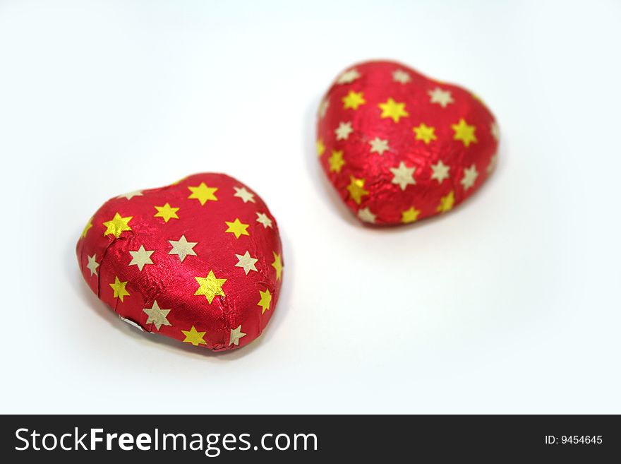 A pair of chocolate candy valentine hearts. A pair of chocolate candy valentine hearts