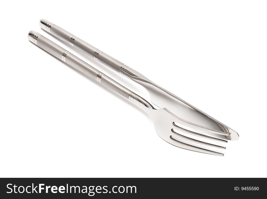Steel knife and fork on a white background
