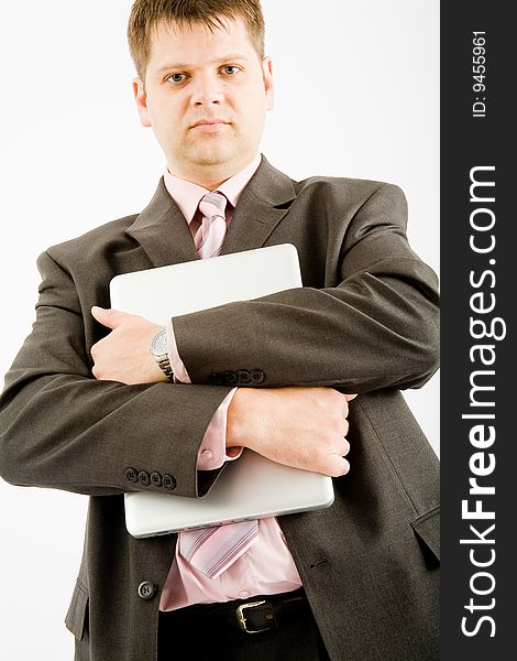 Young business man with laptop computer on white background