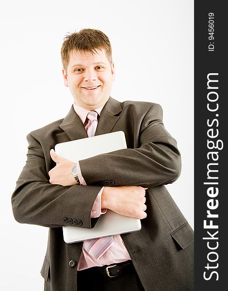 Young business man with laptop computer on white background