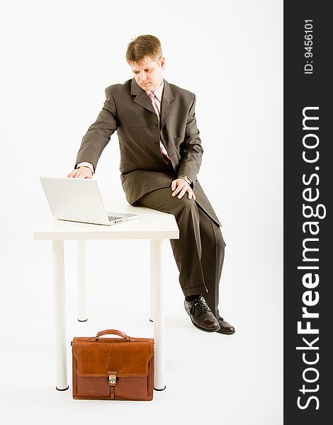 Young business man with laptop