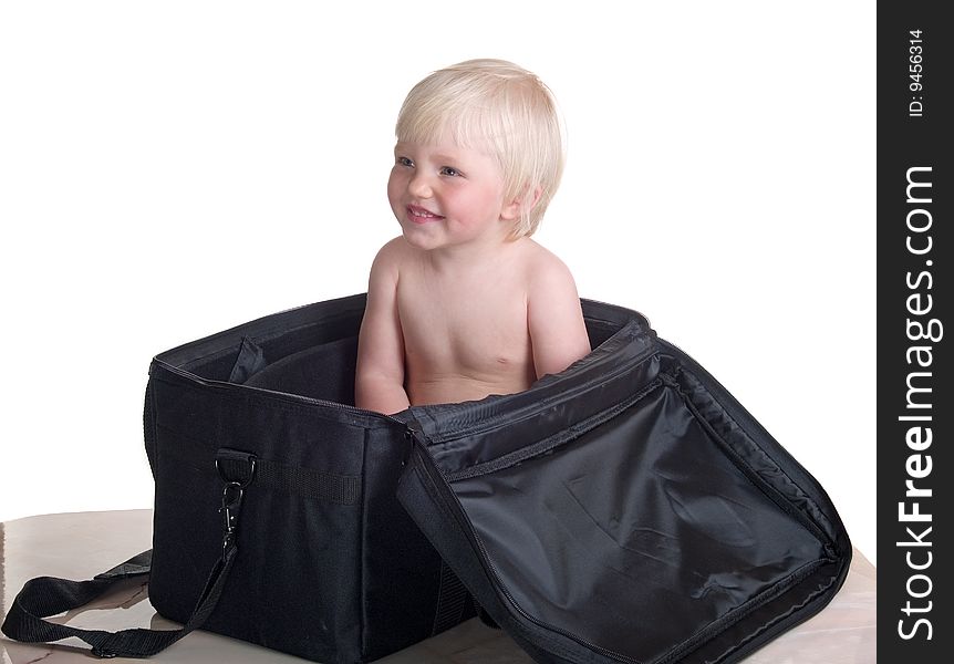 Smiling child into large bag. Smiling child into large bag