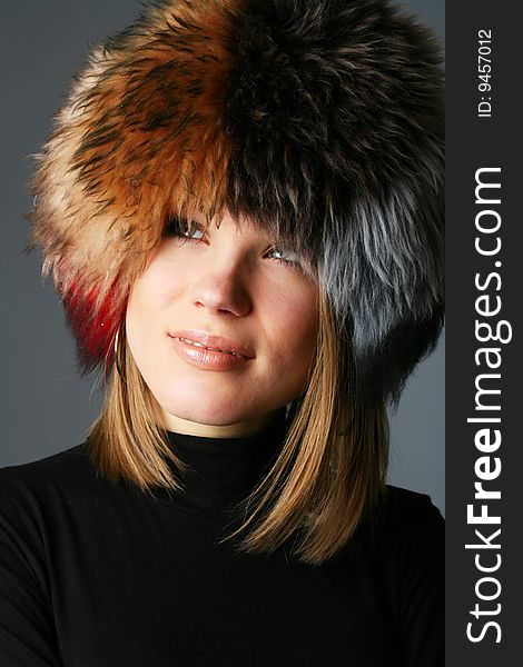 Portrait Of A Beautiful Woman In A Fur Hat