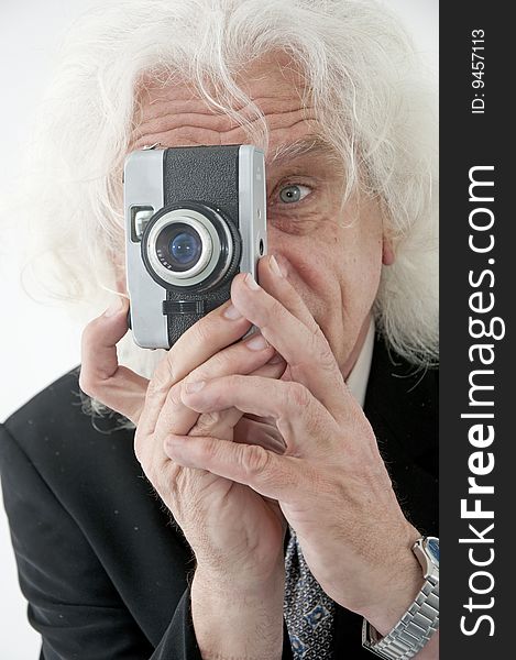 Older man holding a camera