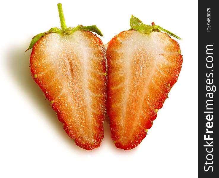 Two half one berry of a ripe strawberry close up. Two half one berry of a ripe strawberry close up