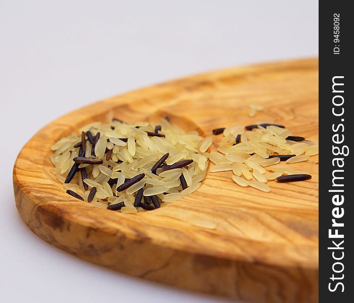Brown rice on a wooden board. Brown rice on a wooden board