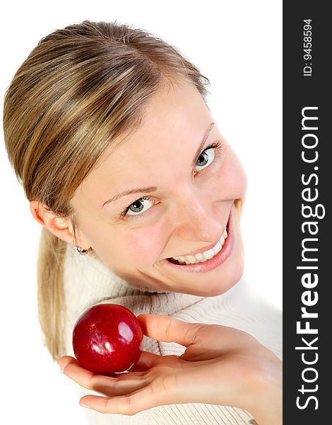 Female holding a fruit in her hand and smlling (healthy lifestyle concept). Female holding a fruit in her hand and smlling (healthy lifestyle concept)