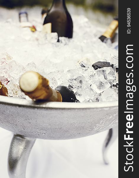 A cooler with ice and bottles of Champagne inside. A cooler with ice and bottles of Champagne inside.