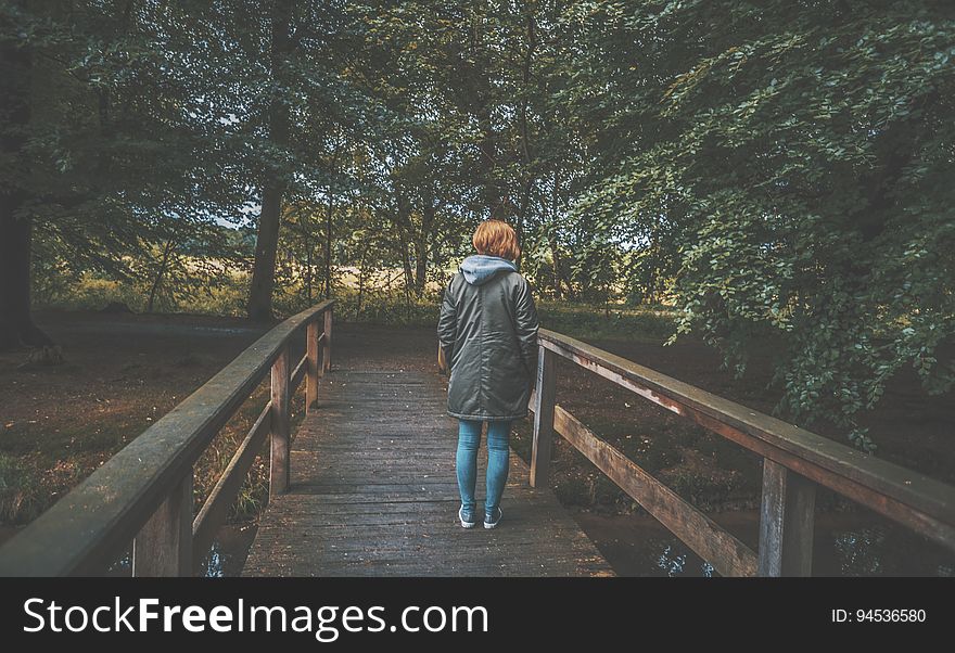 Woman On Wooden Bridge
