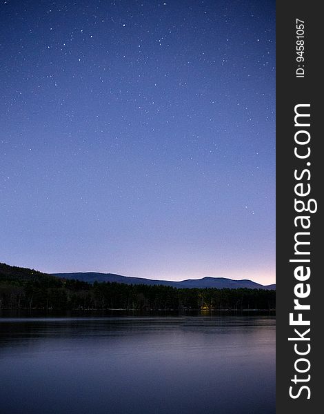 A tranquil lake at dusk.