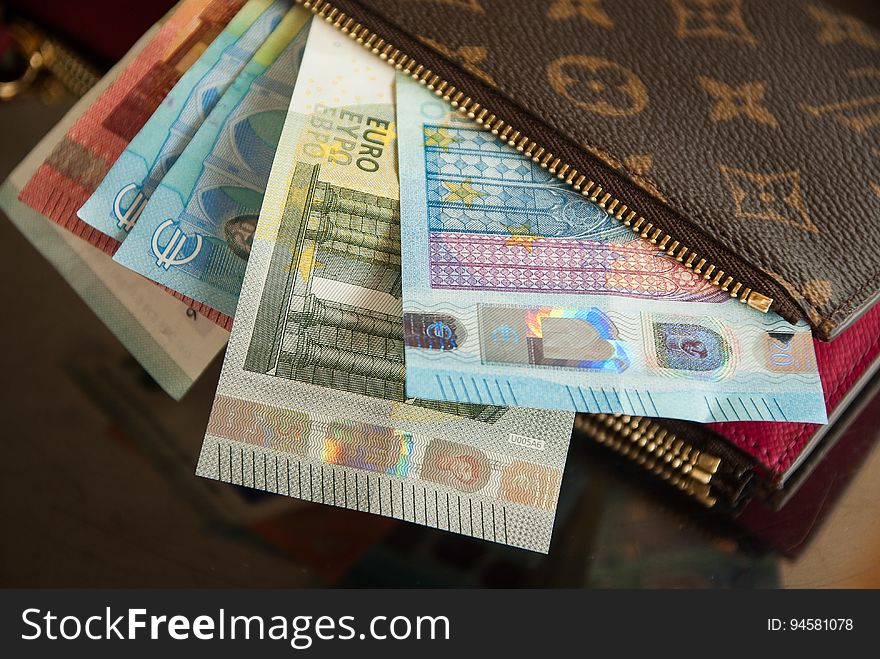 Closeup of a wallet full of Euros.