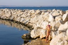 Girl Is On Coast Of The Blue Sea Royalty Free Stock Image Girl Is On Coast Of The Blue Sea Royalty Free Stock Image