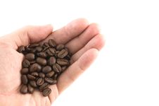Handful Of Coffee Beans Stock Photos