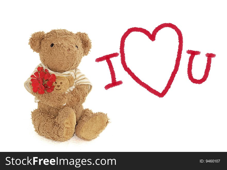 Teddy bear holding little red flowers. Teddy bear holding little red flowers