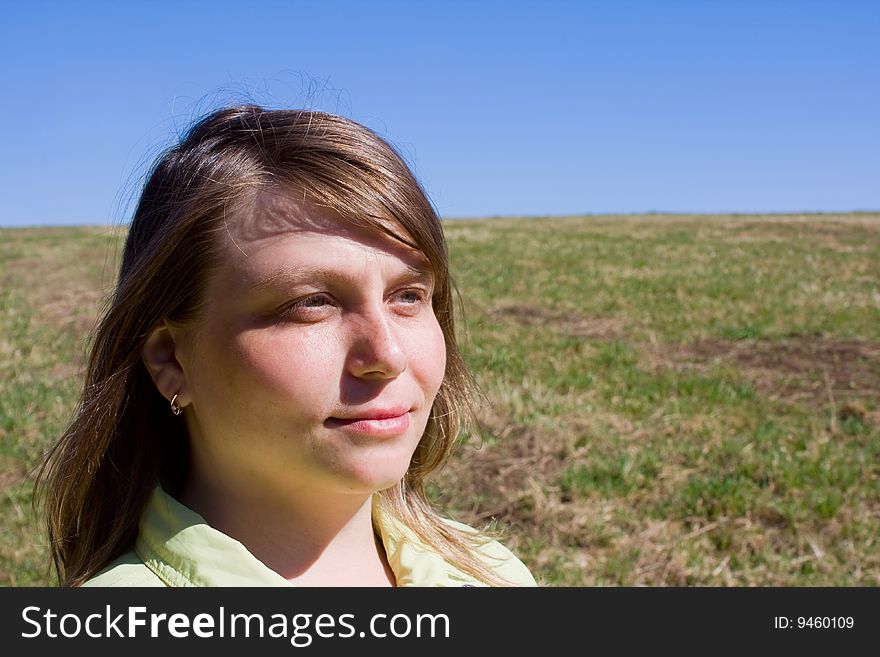 A smiling girl in a field