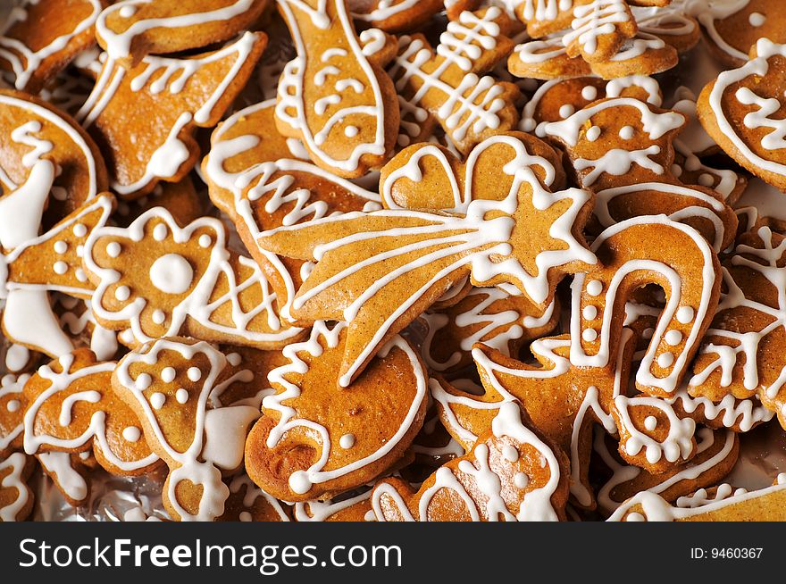 Background of gingerbread cookies decorated with sugar icing