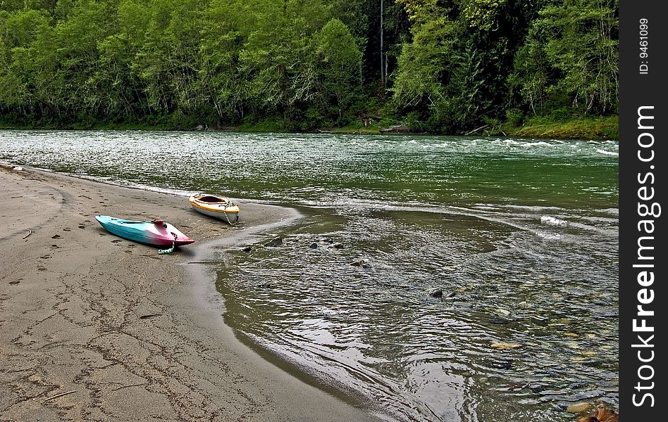 Two Kayaks Along River Bed