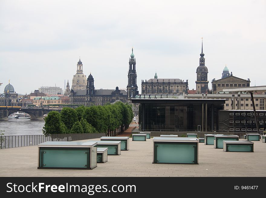 Modern architecture with baroque building in background