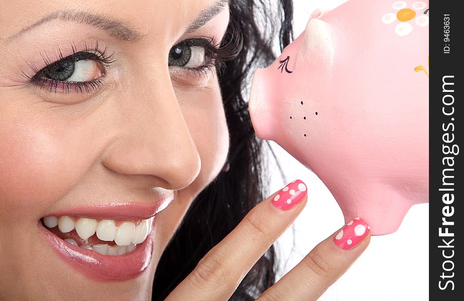 Beautiful lady holding a pig money-box. Beautiful lady holding a pig money-box