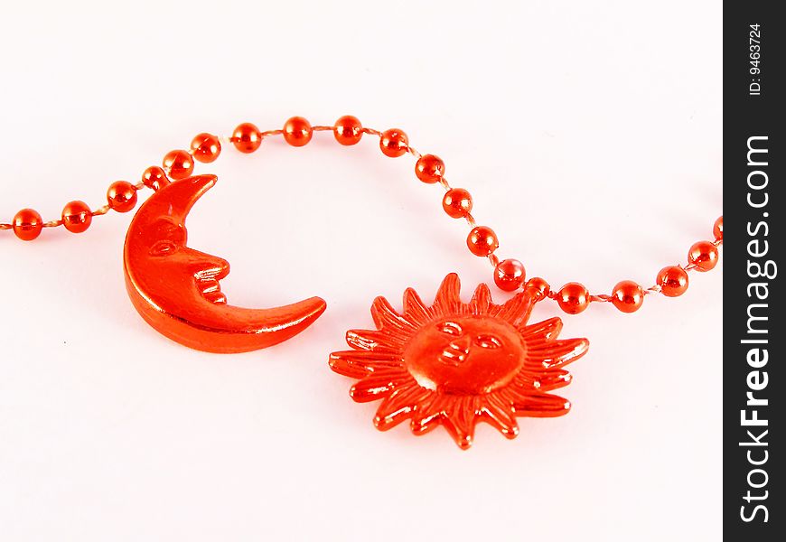Red moon and sun ornaments on white