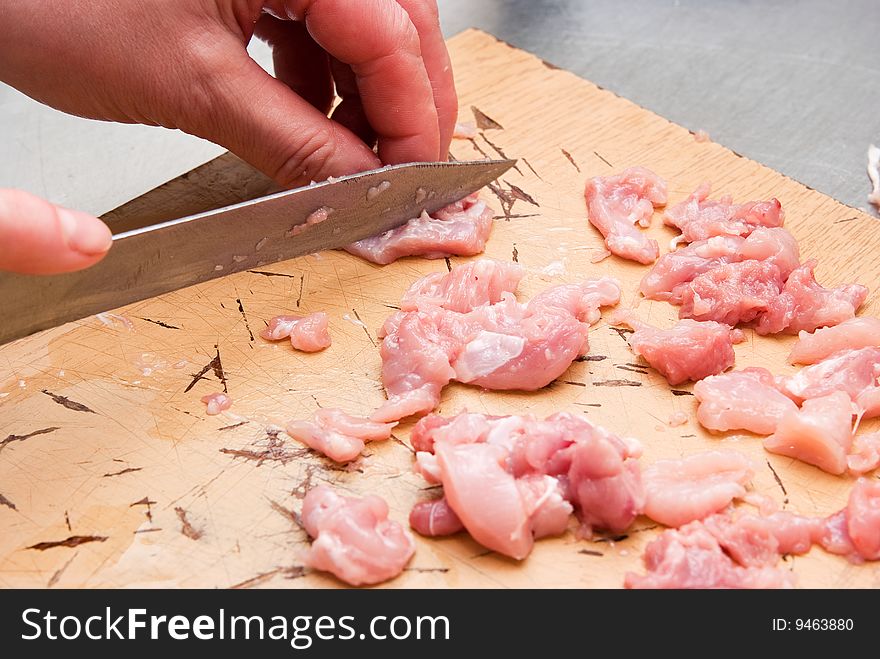 Raw sliced chicken on plate. Raw sliced chicken on plate