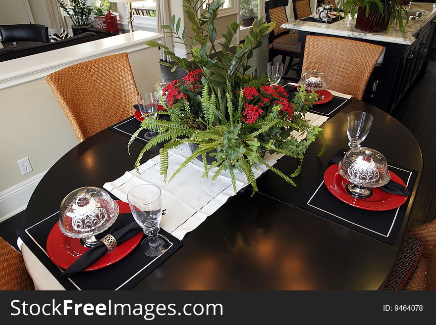 Dining table with modern tableware and decor. Dining table with modern tableware and decor.