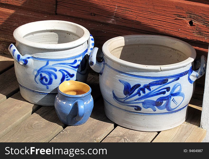 Old margarine pots placed on the porch in the sun