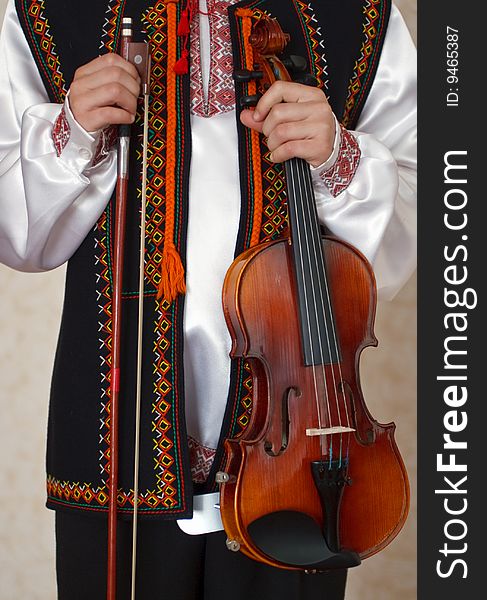 The small violinist dressed in the Ukrainian national clothes