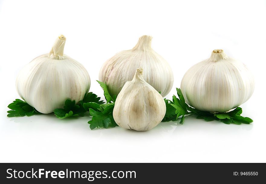 Garlic Vegetable with Green Parsley Leaves Isolated on White Background