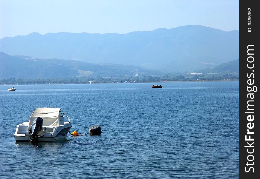 Speed boat on Aegean sea and mountains on background. Speed boat on Aegean sea and mountains on background