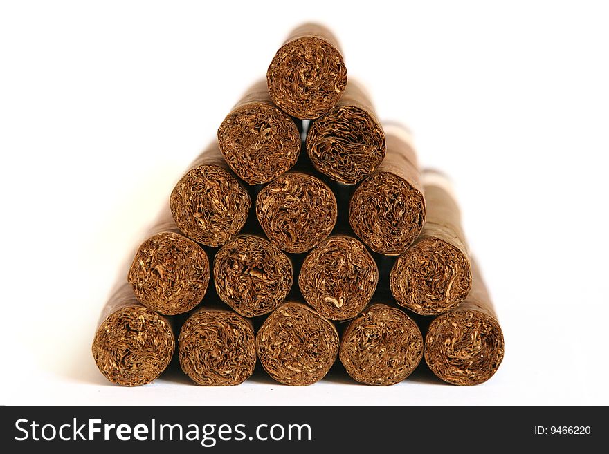Cigars arranged as a triangle stack on a white bacground - frontal picture.