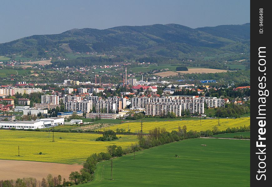 Landscape of Czech country and town under hills