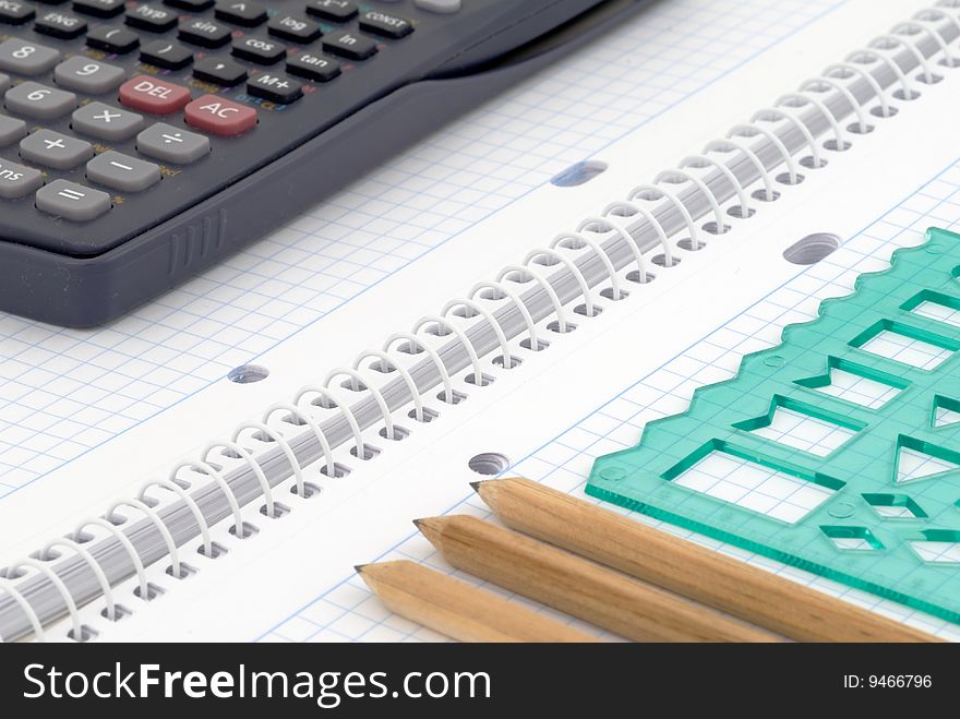 Spiral notebook with blue grid. Selective focus