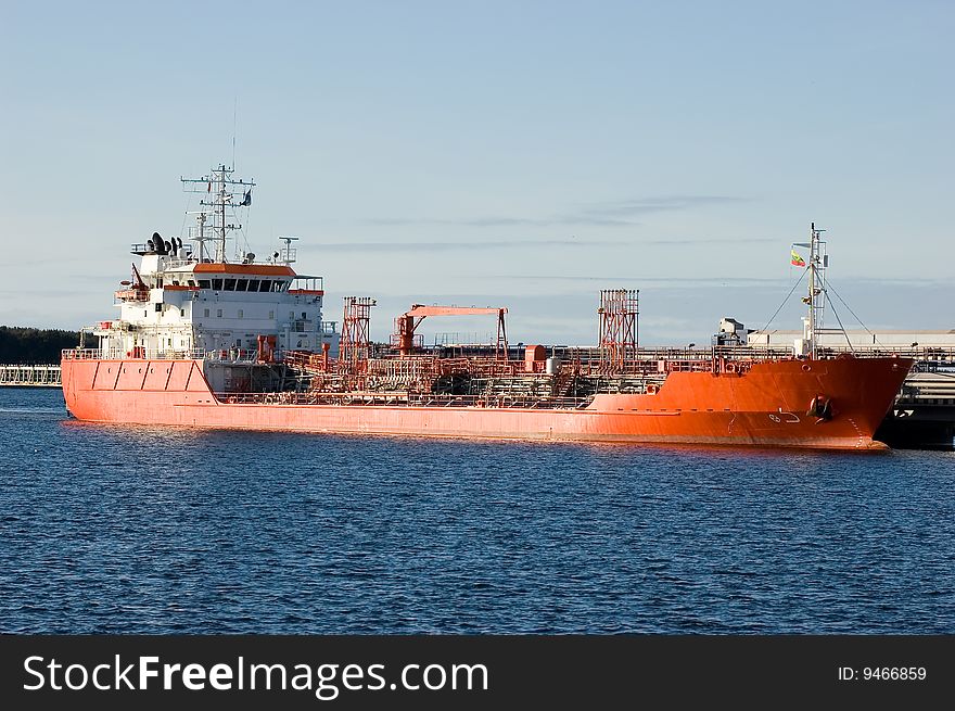 Large container ship in a dock at Klaipeda (Lithuania) harbor (logos and brandnames systematically removed). Large container ship in a dock at Klaipeda (Lithuania) harbor (logos and brandnames systematically removed)