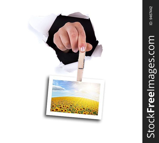 Woman hands holding clip thru white wall hole