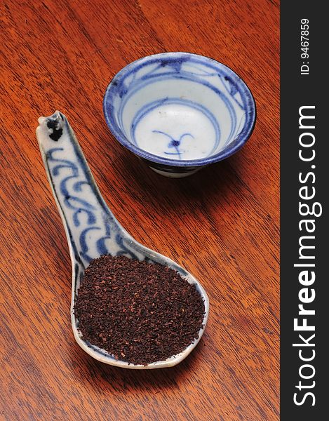 16th Century blue and white tea cup and spoon.