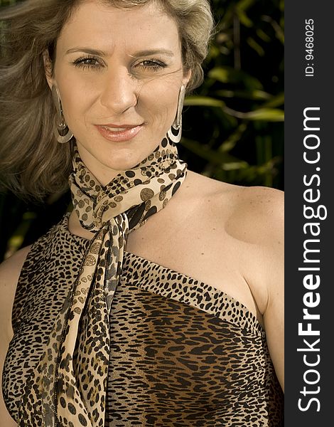 A very pretty and young blond brazilian woman wearing a leopard skin like blouse. A very pretty and young blond brazilian woman wearing a leopard skin like blouse.