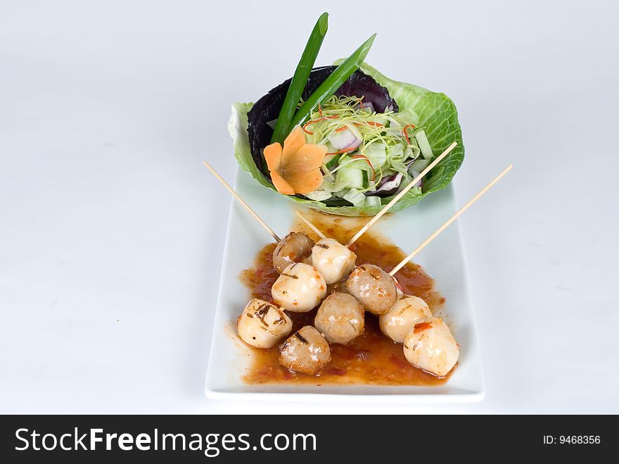 Chicken and beef meatballs with a salad. Chicken and beef meatballs with a salad