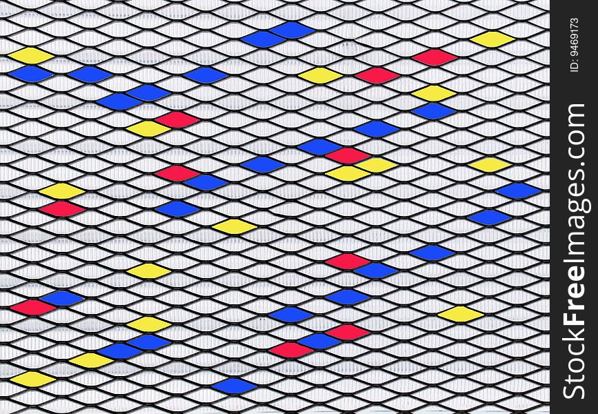 An abstract picture of horizontal diamond shapes in blue, yellow, red and white. An abstract picture of horizontal diamond shapes in blue, yellow, red and white.