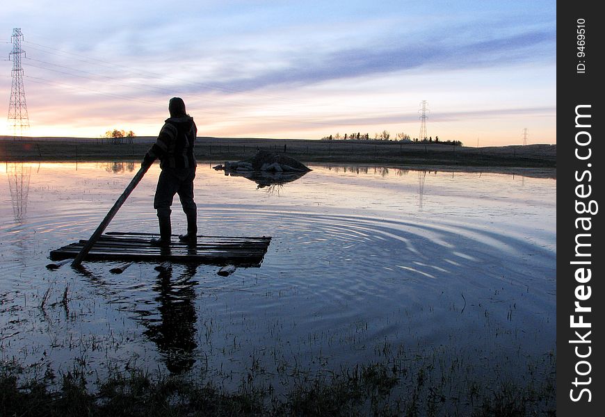 Person sailing raft on lake