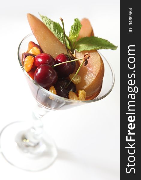 Cocktail with fruits in martini glass