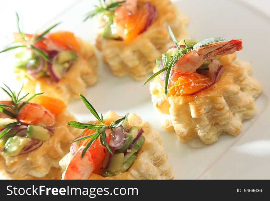 Snack with shrimps on a plate