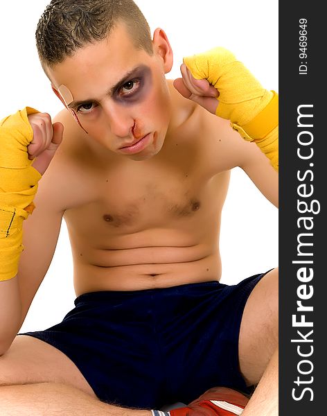 Youngster practicing the art of boxing, studio shot on white background