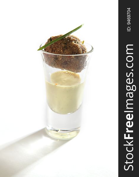Fricandel in a glass on a plate