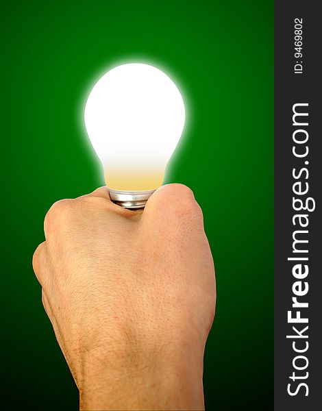 Bulb in a hand on a background