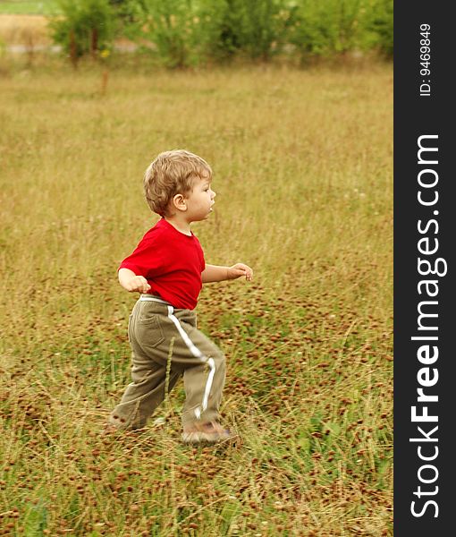 Cognition of world.	A little boy runs on a meadow.