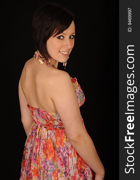 Horizontal closeup portrait of a smiling young woman, isolated against a black background. Horizontal closeup portrait of a smiling young woman, isolated against a black background.