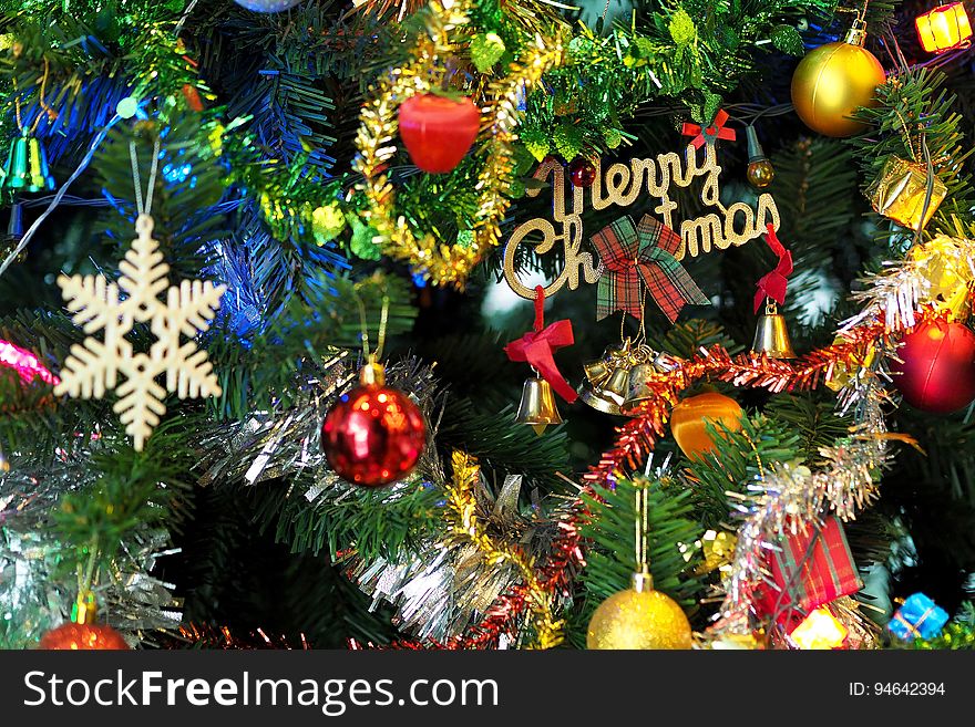 A close up of a Christmas tree with decorations.