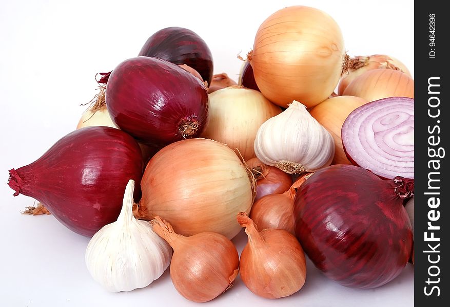 Onion And Garlic On White Surface