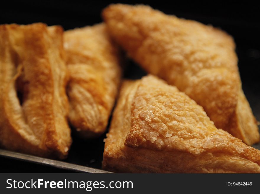 Apple turnovers or other similar pastries on a tray.